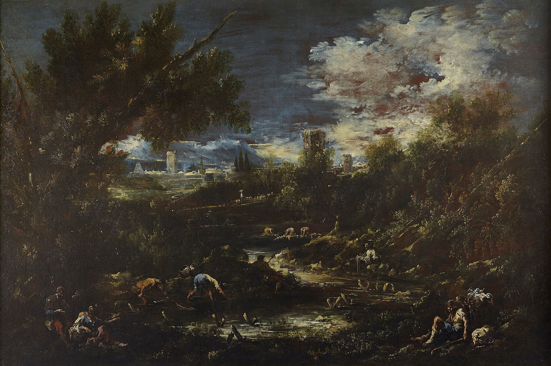 A wooded landscape with travellers and washerwomen by a stream, a fortified town in the background